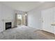Bright living room with sliding glass doors for natural light and a corner fireplace at 855 N Stephanie St # 2415, Henderson, NV 89014