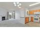 Spacious living room with a fireplace and an open layout to the kitchen and a sliding glass door at 855 N Stephanie St # 2415, Henderson, NV 89014