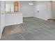 Open layout connecting the living room to the kitchen with updated flooring and fixtures at 855 N Stephanie St # 2415, Henderson, NV 89014