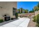 Relaxing lounge area next to the pool, the backyard has lush landscaping and a water feature at 8928 Stafford Springs Dr, Las Vegas, NV 89134