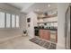 Contemporary bar area includes a wine cooler, custom shelving, and ample counter space at 8928 Stafford Springs Dr, Las Vegas, NV 89134