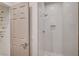 Contemporary bathroom featuring walk-in shower with white tile and a glass door at 8928 Stafford Springs Dr, Las Vegas, NV 89134