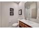 Modern powder room with floating vanity, white countertop, and decorative wall art at 8928 Stafford Springs Dr, Las Vegas, NV 89134