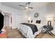 Comfortable bedroom with wood floors, ceiling fan, and built-in closet at 8928 Stafford Springs Dr, Las Vegas, NV 89134