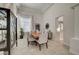 Dining room with natural light, modern chandelier and furniture, adjacent to the kitchen at 8928 Stafford Springs Dr, Las Vegas, NV 89134