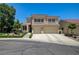 Inviting two-story home with a tile roof, desert landscaping, and an attached two-car garage at 8928 Stafford Springs Dr, Las Vegas, NV 89134