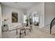 Inviting foyer with staircase leads to open-concept living spaces, showcasing modern design at 8928 Stafford Springs Dr, Las Vegas, NV 89134