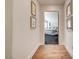 Hallway with hardwood floors leading into bedroom featuring a light-filled room at 8928 Stafford Springs Dr, Las Vegas, NV 89134