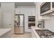 A modern kitchen featuring stainless steel appliances and stylish white cabinets at 8928 Stafford Springs Dr, Las Vegas, NV 89134
