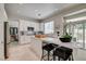 Open kitchen with a marble countertop island, stainless steel appliances, and modern finishes at 8928 Stafford Springs Dr, Las Vegas, NV 89134