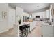 Bright kitchen with white cabinets, a center island with seating, and modern appliances at 8928 Stafford Springs Dr, Las Vegas, NV 89134