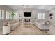 Bright living room boasts a fireplace, large windows, and stylish decor, perfect for relaxing at 8928 Stafford Springs Dr, Las Vegas, NV 89134