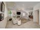 Open-concept living room with fireplace, wet bar, and ample seating at 8928 Stafford Springs Dr, Las Vegas, NV 89134