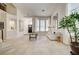 Bright and open living room features tile floors, neutral decor, and plenty of natural light at 8928 Stafford Springs Dr, Las Vegas, NV 89134
