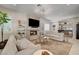 Inviting living room features a fireplace, wet bar, neutral tones and modern lighting at 8928 Stafford Springs Dr, Las Vegas, NV 89134