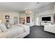 This main bedroom is spacious, with gray carpet, high ceilings and modern decorative touches at 8928 Stafford Springs Dr, Las Vegas, NV 89134