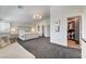 Spacious bedroom with sitting area, walk-in closet, and modern chandelier at 8928 Stafford Springs Dr, Las Vegas, NV 89134