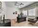 Bright office space with wood floors, neutral paint, and a ceiling fan at 8928 Stafford Springs Dr, Las Vegas, NV 89134