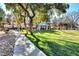 Lush park with a gazebo, walking path, green grass and mature shade trees at 8928 Stafford Springs Dr, Las Vegas, NV 89134