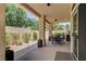 Covered patio with a dining table and chairs, perfect for outdoor entertaining in a private backyard at 8928 Stafford Springs Dr, Las Vegas, NV 89134