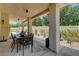 Spacious covered patio with outdoor dining, planters, and privacy wall, ideal for entertaining at 8928 Stafford Springs Dr, Las Vegas, NV 89134