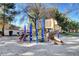 Playground with colorful slides and climbing structures nestled in a sandy play area at 8928 Stafford Springs Dr, Las Vegas, NV 89134