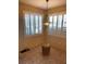Breakfast nook featuring natural light, two windows with plantation shutters and a stylish hanging light fixture at 9050 W Warm Springs Rd # 1092, Las Vegas, NV 89148
