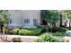 Well-maintained exterior with manicured landscaping, lush greenery, and mature trees at 9050 W Warm Springs Rd # 1092, Las Vegas, NV 89148
