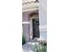 Inviting front entry with stylish door, decorative wreath, and manicured plants at 9050 W Warm Springs Rd # 1092, Las Vegas, NV 89148