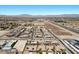 Panoramic aerial of desert homes with solar panels and community amenities close to shopping with highway access at 9233 Onyx Point Ct, Henderson, NV 89074