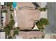 Aerial view showcasing home's roof, solar panels, backyard patio, pool, and landscaping at 9233 Onyx Point Ct, Henderson, NV 89074