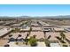 Aerial view of homes with desert landscaping and solar panels showing the architectural style and community layout at 9233 Onyx Point Ct, Henderson, NV 89074
