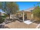 View of backyard patio featuring an outdoor seating area and gravel landscaping at 9233 Onyx Point Ct, Henderson, NV 89074