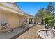 View of backyard patio with gravel landscaping and built-in fire pit at 9233 Onyx Point Ct, Henderson, NV 89074