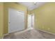 Bedroom with sliding closet doors, tan carpet, and cream colored walls at 9233 Onyx Point Ct, Henderson, NV 89074