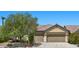 Charming single-story home featuring desert landscaping, a tile roof, and a spacious three-car garage at 9233 Onyx Point Ct, Henderson, NV 89074