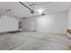 Spacious garage featuring a water heater, garage door opener, and ample room for storage at 9233 Onyx Point Ct, Henderson, NV 89074