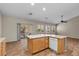 Kitchen island features a sink, cabinetry, and an outdoor view at 9233 Onyx Point Ct, Henderson, NV 89074