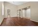 Spacious living area with hardwood floors, neutral walls, and an arched entrance at 9233 Onyx Point Ct, Henderson, NV 89074