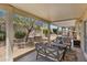 View of covered patio featuring chairs, patio furniture, and gravel landscaping at 9233 Onyx Point Ct, Henderson, NV 89074