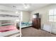 Bedroom with bunk beds, dresser, ceiling fan, and ample space for or guests at , Las Vegas, NV 89166