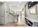 Inviting entryway with tile, staircase, and a glimpse into the home's airy living space at , Las Vegas, NV 89166