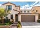 Charming two-story home boasting a neat lawn, neutral paint, and a spacious two-car garage at , Las Vegas, NV 89166