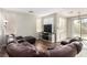 Comfortable living room featuring a plush sectional, modern fixtures, and a sliding door to backyard at , Las Vegas, NV 89166