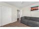 Living room has a comfortable couch, closet, neutral walls, and carpeted floors at , Las Vegas, NV 89166