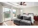 Main bedroom featuring a private balcony, tray ceiling, and ceiling fan at , Las Vegas, NV 89166