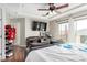 Stylish main bedroom with balcony access, mounted TV, and organized closet at , Las Vegas, NV 89166