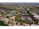 An aerial view featuring tennis courts, swimming pool, and beautiful desert landscaping at 10240 Notte Ave, Las Vegas, NV 89135