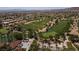 Beautiful aerial view of golf course and community featuring lush green fairways and meticulously maintained landscaping at 10240 Notte Ave, Las Vegas, NV 89135