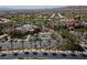 Aerial view of the community showcasing the pool, golf course, and surrounding landscape at 10240 Notte Ave, Las Vegas, NV 89135